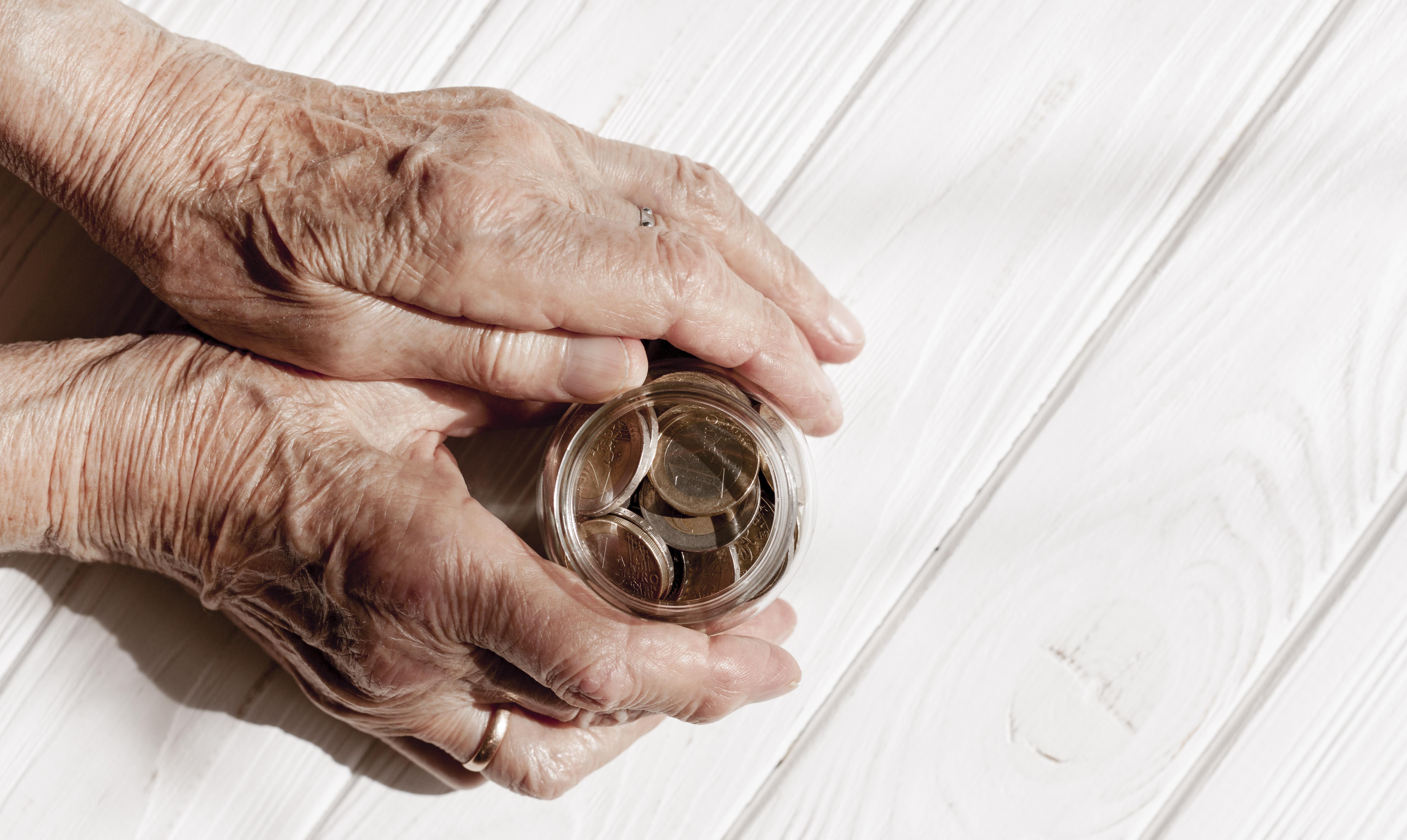 hands-holding-jar-coins